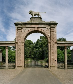 Detail of lion gate at Ladykirk House with date plaque "1799" from SW
