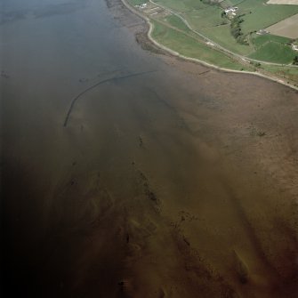 Oblique aerial view centred on the remains of the fish traps, taken from the SE.