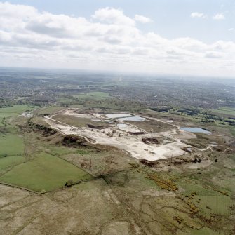 General oblique aerial view looking across the quarry towards Milngavie and Bearsden, taken from the WNW.