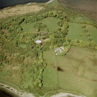 Oblique aerial view centred on the country house, stable, stable block and tower, taken from the SSE.