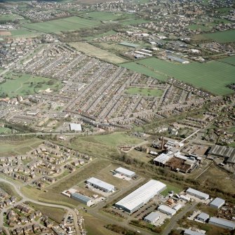 Oblique aerial view centred on the village, miners' rows and colliery, taken from the SW.