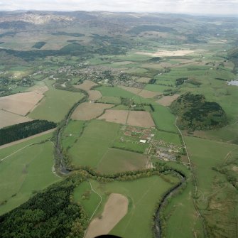 Oblique aerial view looking across the military camp and house towards Comrie, taken from the SW.