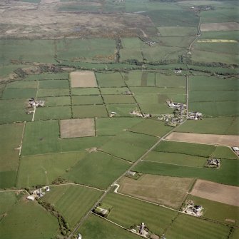 General oblique aerial view centred on the village and farmsteadings, taken from the WNW.