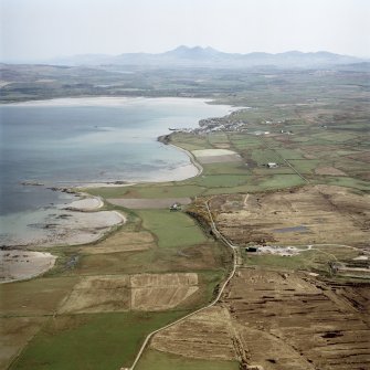 General oblique aerial view looking across Ardlarach towards Bowmore and the Paps of Jura beyond, taken from the WSW.