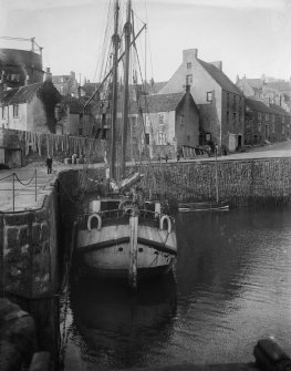 View from south of a boat docked in the harbour.