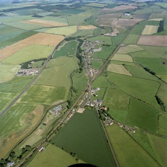 General oblique aerial view looking across the village towards the village of Ayton, taken from the W.