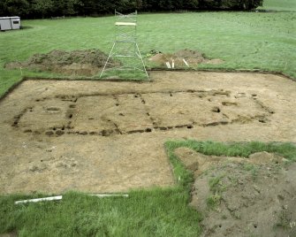 Site under excavation. Hi-spy view from SE with ranging poles.