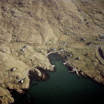 Oblique aerial view centred on the harbour, with the post office adjacent adjacent, taken from the NNW.