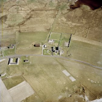Oblique aerial view centred on the farmhouse, with the farmstead and the farmsteading adjacent, taken from the NW