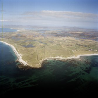 General oblique aerial view over the Isle of Benbecula with Eaval and Ronay in the distance, taken from the SSW.