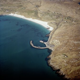 Oblique aerial view centred on the slipway and the jetty  with the remains of the township adjacent, taken from the SW.