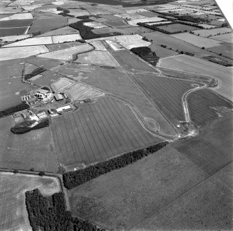 Scanned image of oblique aerial view centred on the airfield, taken from the W.