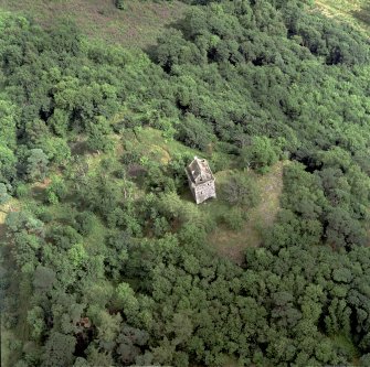Oblique aerial view centred on the remains of the tower-house, taken from the WSW.
