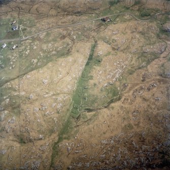 Oblique aerial view centred on the remains of the township, taken from the W.