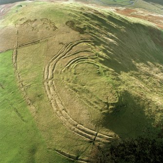 Woden Law, fort and associated monuments: air photograph under conditions of low light.
RCAHMS, 1994.