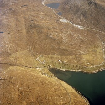 General oblique aerial view centred on the township with the quarry adjacent, taken from the WSW.
