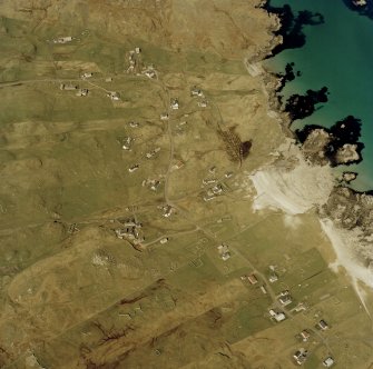 Oblique aerial view centred on the townships and the remains of the buildings, taken from the SSE.