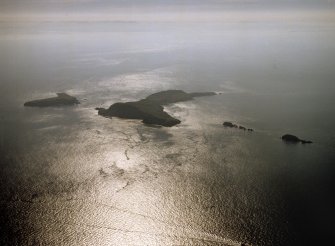 General oblique aerial view looking towards the Shiant Islands, taken from the NW.