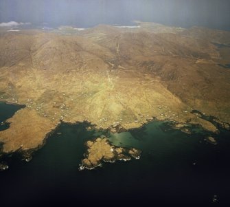 General oblique aerial view centred on the crofting townships of Skallary and Earsary, looking across Sheabhal towards Borgh, taken from the SE.