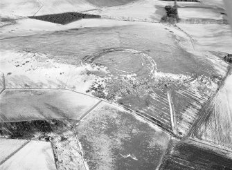 Oblique aerial view centred on the remains of the fort and rig and furrow at Barra Hill, looking to the ENE.