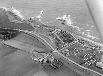 General oblique aerial view centred on the village of Cowie, Stonehaven, looking to the ENE.