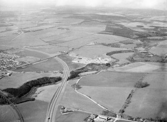 General oblique aerial view centred on Glenury Viaduct, sand and gravel workings and Stonehaven bypass, looking to the W.