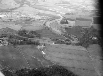 General oblique aerial view centred on the Old Parish Church at Dyce and the River Don, looking to the W.