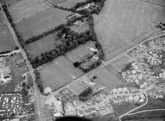 General oblique aerial view centred on the village of Blackburn, looking to the WNW.
