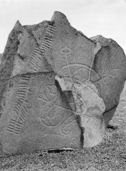 Detail of Brandsbutt ogham inscribed Pictish symbol stone showing a serpent, Z-rod and crescent symbol.