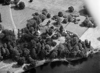 Oblique aerial view centred on Meikleour House and policies, looking to the E.
