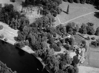 Oblique aerial view centred on Meikleour House and policies, looking to the NNE.