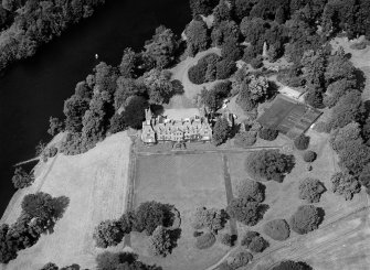Oblique aerial view centred on Meikleour House and policies, looking to the NW.