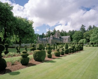 View from SE showing topiary garden with Glenkindie House, Aberdeenshire, behind.