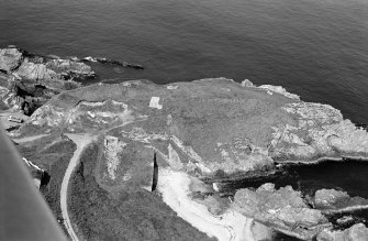 Oblique aerial view of Green Castle, Portnockie, looking to the NW.