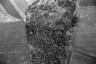 Oblique aerial view centred on the remains of a barrow at Midtown of Pitglassie, looking to the NNE.