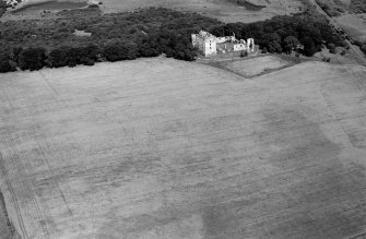 Oblique aerial view centred on the remains of Spynie Palace, looking to the NNE.