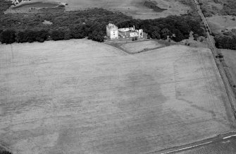 Oblique aerial view centred on the remains of Spynie Palace, looking to the N.