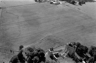 Oblique aerial view centred on the remains of Spynie Palace, looking to the SSW.
