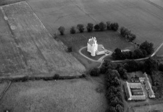 Blurry oblique aerial view centred on Harthill Castle, looking to the NNE.