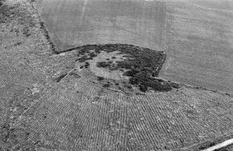 Oblique aerial view centred on the remains of the fort at Cairnmore, looking to the S.