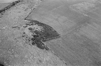 Oblique aerial view centred on the remains of the fort at Cairnmore, looking to the ESE.