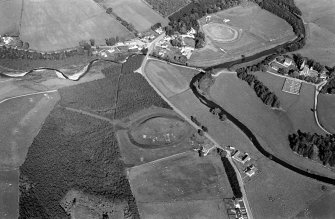 Oblique aerial view centred on the remains of the castle and motte of Doune of Invernochty, looking to the ENE.
