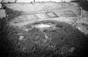 Oblique aerial view centred on the remains of the vitrified fort at Craig Phadrig, looking to the WNW.