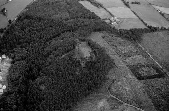 Oblique aerial view centred on the remains of the vitrified fort at Craig Phadrig, looking to the SW.