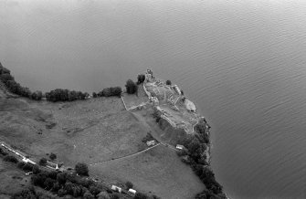 Oblique aerial view centred on Urquhart Castle, looking to the ENE.