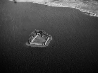 Oblique aerial view centred on the remains of Lochindorb Castle, looking to the ENE.