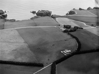 Oblique aerial view centred on the Stonehaven coastal radio station and the distant remains of Dunnottar Castle, looking to the E.