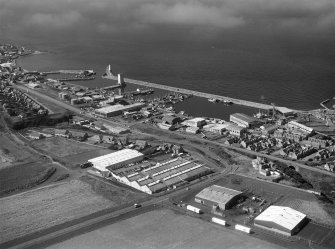 Oblique aerial view centred on the harbour and town of Buckie, looking to the WNW.