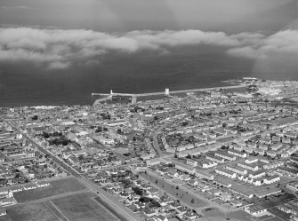 Oblique aerial view centred on the harbour and town of Buckie, looking to the NNE.