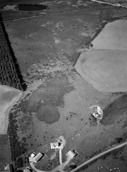 Oblique aerial view centred on the remains of hut circles at Camore and Sydera Wood, looking to the NNE.